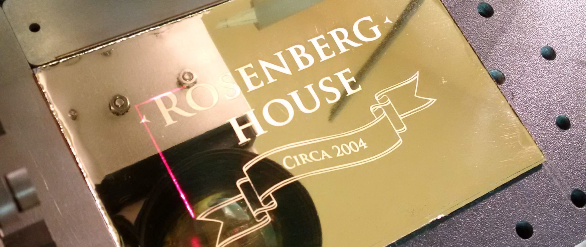 Engraved Metal Labels: Laser Etching Gold-Colored Metal. Engraving Reads "Rosenberg House Circa 2004" and is extremely neatly engraved.