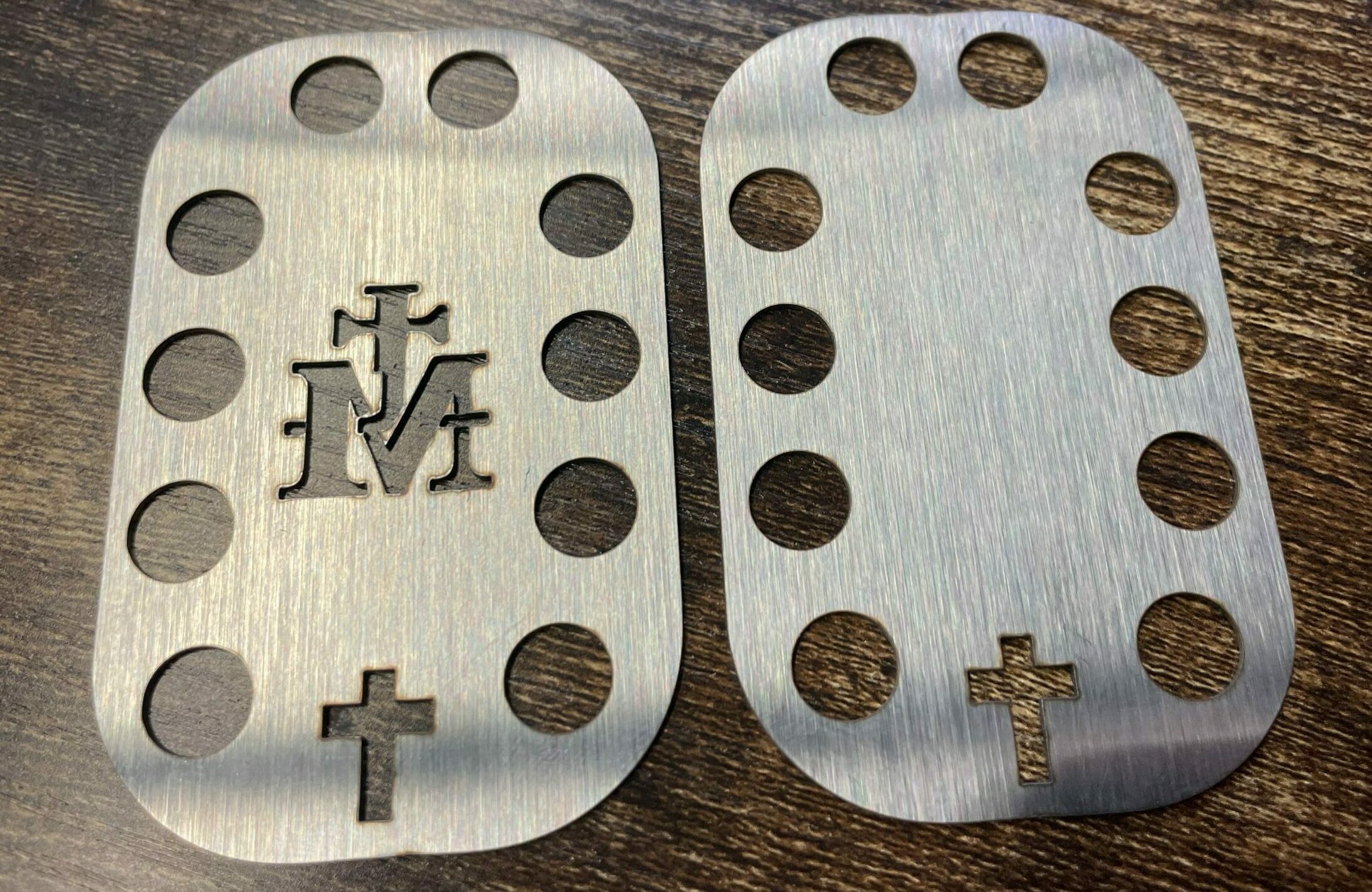 Plate Logo: cross combined with an M